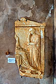 Hania - the Archaeological Museum, Fragment of Funerary relief, before the seated dead woman stands another young (4th c. BC) found at Khania, 1963. 